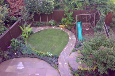 Aerial photo oftown garden just completed with curving path around lawn, patio and water feature